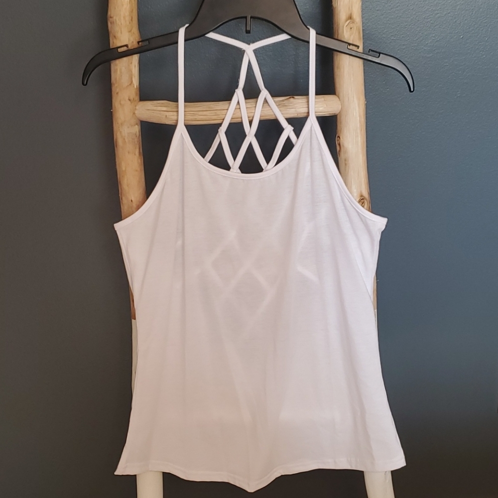 white cami with a criss-cross back and spaghetti straps. Small